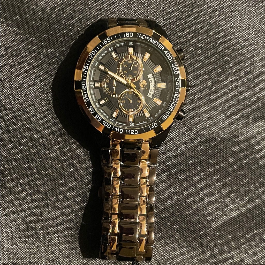 Gold And Black Chronograph Watch